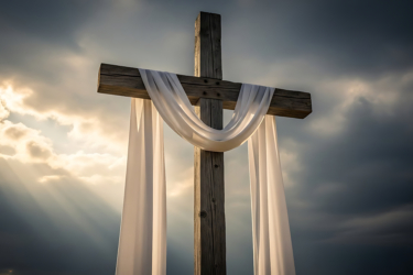 Wooden cross draped with a white cloth